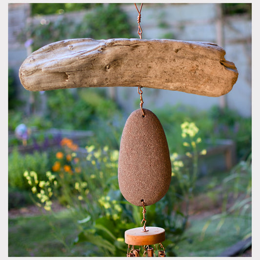 detail, driftwood and beach stone wind chime
