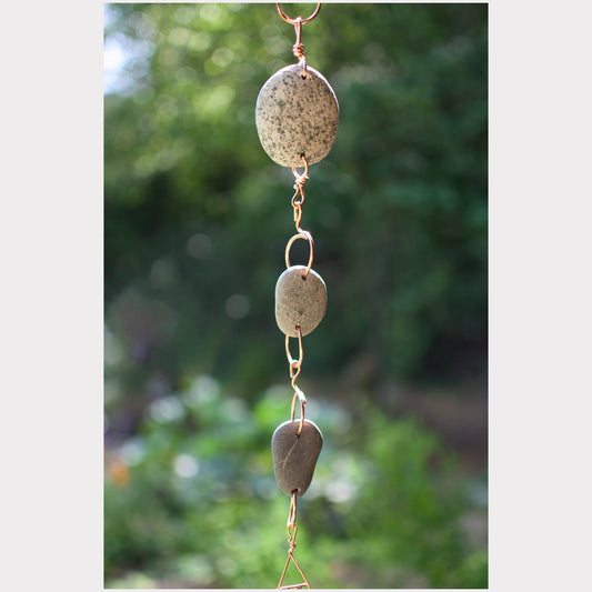 Detail, natural beach stone wind chime.