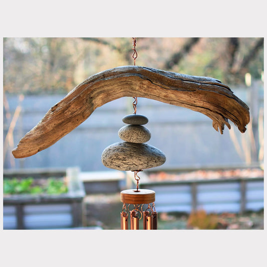 detail, driftwood and beach stone wind chime