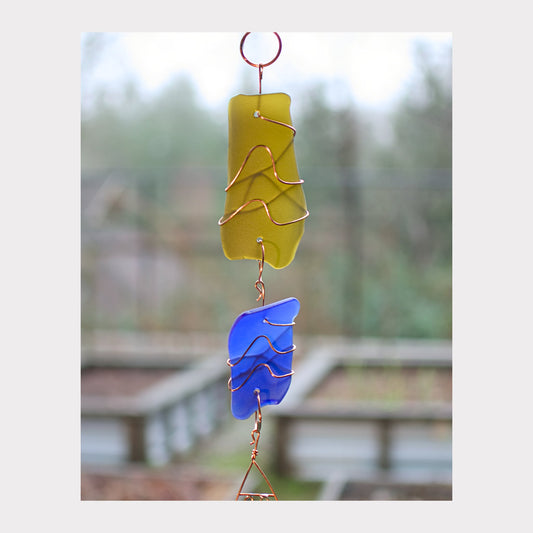 zoom detail, glass and copper wind chime