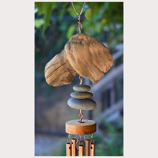 Detail, driftwood and beach stone wind chime.