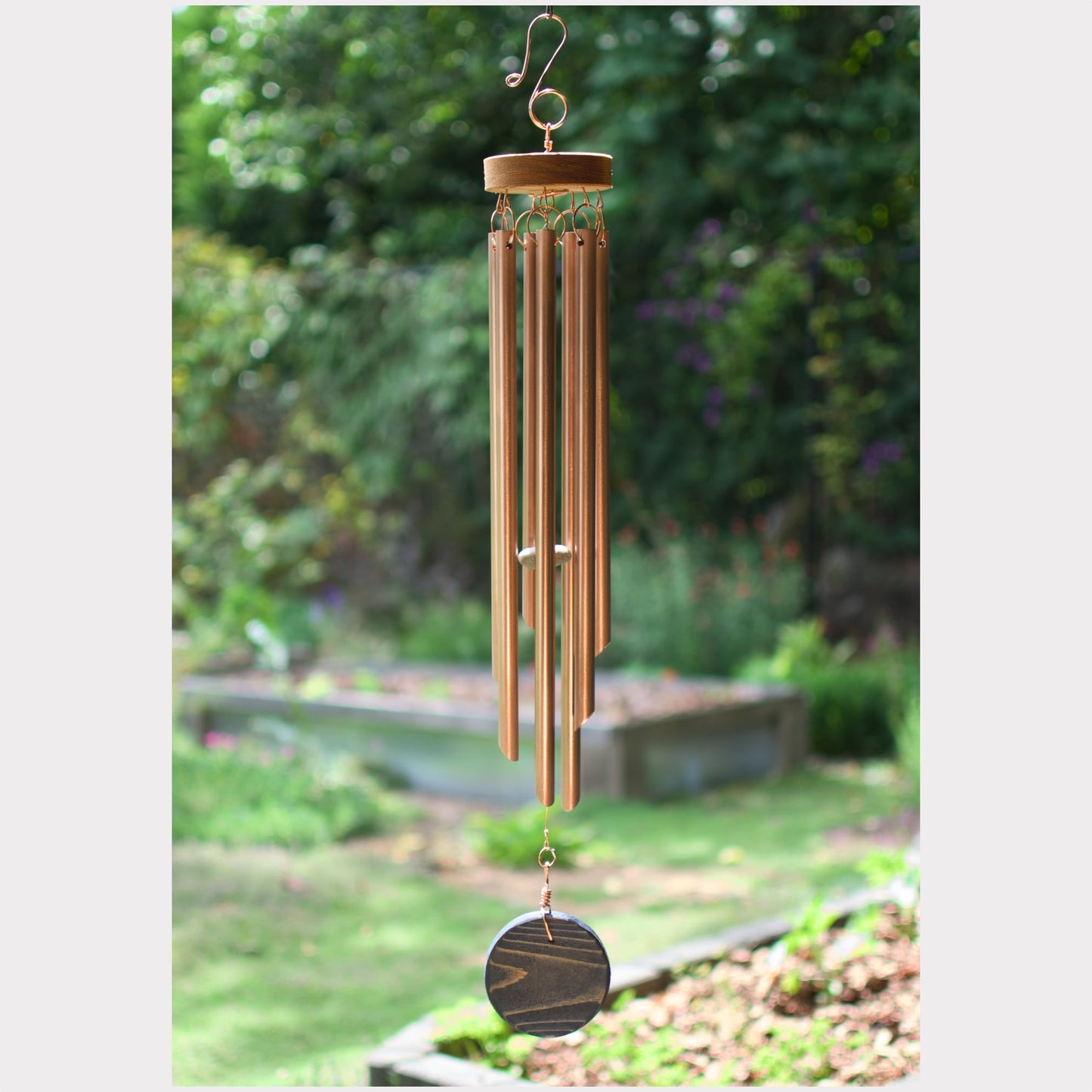 Wind chime featuring 7 genuine copper chimes and a West Coast Storm cedar windsail.