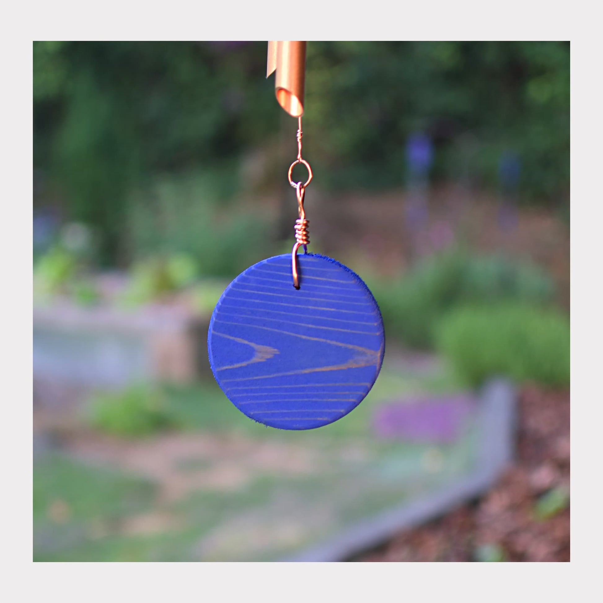 Ocean blue oiled cedar windsail for a large copper wind chime.