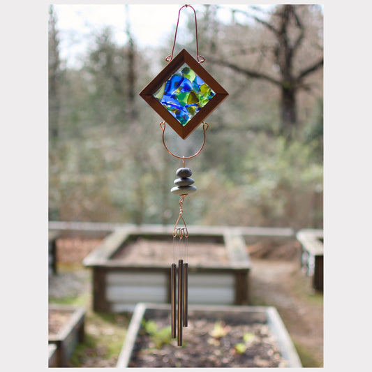 Kaleidoscope wind chime with three beach stones and three antiqued brass chimes.
